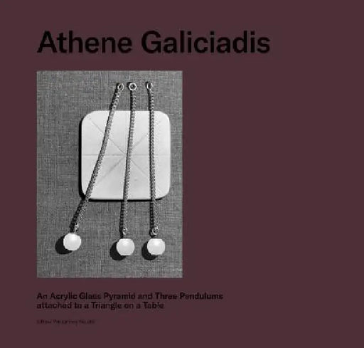Athene Galiciadis: An Acrylic Glass Pyramid and Three Pendulums Attached to a Triangle on a Table by Athene Galiciadis
