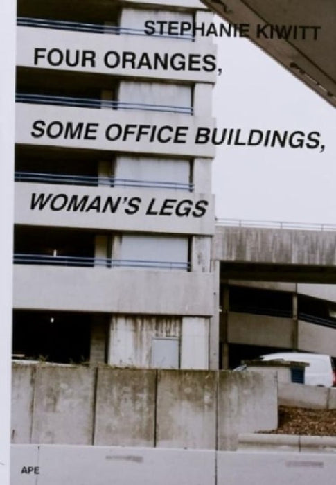 Four Oranges, Some Office Buildings, Woman’s Legs by Stephanie Kiwitt
