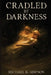 Cradled by Darkness by Michael K. Simpson