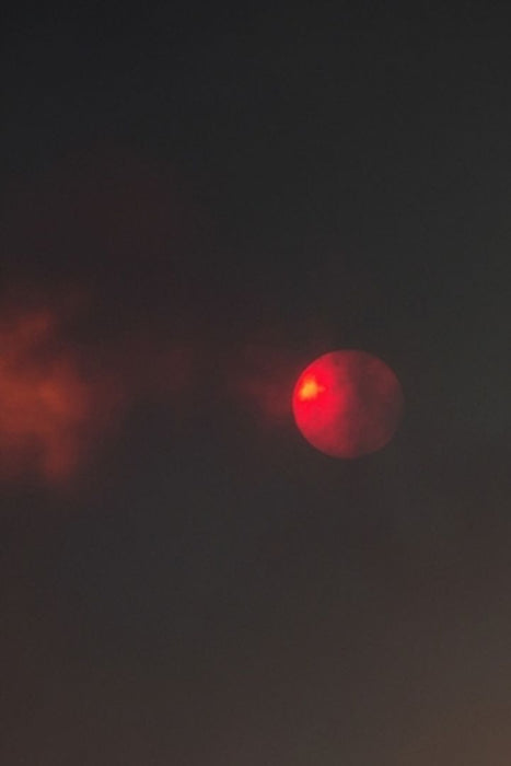 Here Comes the Sun: Photos of the Sun in New Mexico Fires by Carl M. Moore