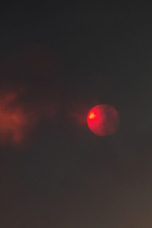 Here Comes the Sun: Photos of the Sun in New Mexico Fires by Carl M. Moore